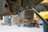 Opposing side view of Rust Buster Forward Leaf Spring Mount For 1995-2004 Toyota Tacoma RB7111 installed to the frame
