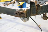 Wide angle of Rust Buster Forward Leaf Spring Mount For 1995-2004 Toyota Tacoma RB7111 installed to the frame rail