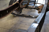 Rust Buster Transmission Crossmember For 1973-1987 Chevy K10 RB7364 installed between the frame rails, as seen from the front left side of the vehicle