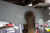 Close-up shot of the Rust Buster Shackle Mount Frame Repair Kit For 1987-1995 Jeep Wrangler RB2002 installed to the vehicle