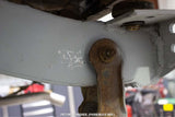 Close-up shot of the Rust Buster Shackle Mount Frame Repair Kit For 1987-1995 Jeep Wrangler RB2002 installed to the vehicle