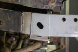 Close-up shot of Rust Buster Frame Shackle Mount Repair Kit for 1987-1995 Jeep Wrangler RB2004 installed to the frame