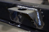 Side view of one Rust Buster Body Mount Brackets For 1987-1995 Jeep Wrangler RB2016 installed to the frame rail
