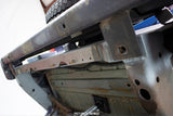 Side view of Rust Buster Rear Crossmember For 1997-2006 Jeep Wrangler RB4022 installed to the frame rail