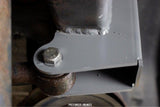 Side view of Rust Buster Track Bar Bracket For 1997-2006 Jeep Wrangler RB4023 installed to the frame rail