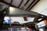 View from beneath the Rust Buster Over-Axle Frame Repair Kit For 1997-2003 Ford F-150 RB7002 installed to the frame rail