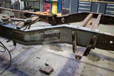 Side view of the Rust Buster Leaf Spring Frame Repair Kit For 1997-2003 Ford F-150 RB7003 installed to the frame rail