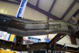 View from beneath the Rust Buster Leaf Spring Frame Repair Kit For 1997-2003 Ford F-150 RB7003 installed to the frame rail