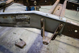 Overhead shot of the Rust Buster Leaf Spring Frame Repair Kit For 1997-2003 Ford F-150 RB7003 installed to the frame rail