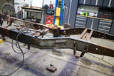 Wide angle of the Rust Buster Leaf Spring Frame Repair Kit For 1997-2003 Ford F-150 RB7003 installed to the frame rail