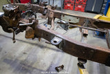 Wide angle, side view, of the Rust Buster Front Cab Mount For 1997-2003 Ford F-150 RB7007 installed to the frame rail