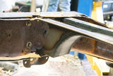 Close-up shot of the Rust Buster Fuel Tank Crossmember For 1997-2003 Ford F-150 RB7010 installed to one of the two frame rails