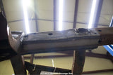 View from beneath the Rust Buster Rear Frame Repair Kit For 2009-2014 Ford F-150 RB7012 installed to the frame rail