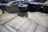 Side view of the Rust Buster Forward Leaf Spring Frame Repair Kit For 2009-2014 Ford F-150 RB7014 installed to the frame rail