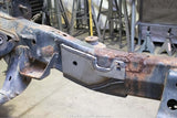 Wide view of the Rust Buster Front Frame Repair Kit For 2009-2014 Ford F-150 RB7017 installed to the frame rail