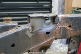 Opposing side view of the Rust Buster Front Bed Mount For 2009-2014 Ford F-150 RB7018 installed to the frame rail