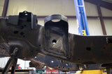 View from beneath the Rust Buster Rear Cab Mount For 2009-2014 Ford F-150 RB7019 installed to the frame rail
