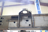 View from beneath the Rust Buster Center Cab Mount For 2009-2014 Ford F-150 RB7020 installed to the frame rail