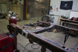 Side view, wide angle of the Rust Buster Forward Spare Tire Crossmember For 2009-2014 Ford F-150 RB7023 installed to the frame