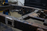 Side view of the Rust Buster Forward Spare Tire Crossmember For 2009-2014 Ford F-150 RB7023 installed to the frame