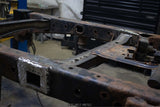 Side view of the Rust Buster Forward Spare Tire Crossmember For 2009-2014 Ford F-150 RB7023 installed to the frame
