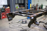 Side view of the Rust Buster Rear Spare Tire Crossmember For 2009-2014 Ford F-150 RB7028 installed to the frame