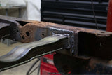 Close-up shot of the Rust Buster Rear Spare Tire Crossmember For 2009-2014 Ford F-150 RB7028 welded to the frame rail
