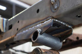 Side view of Rust Buster Rear Leaf Spring Shackle Mount For 1995-2004 Toyota Tacoma RB7101 installed to the frame rail