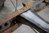 Close angle of Rust Buster Spare Tire Crossmember For 1995-2004 Toyota Tacoma RB7121 bolted to the frame rail