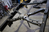 Side view of Rust Buster Spare Tire Crossmember For 2005-2015 Toyota Tacoma RB7131 installed to the frame