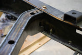 Close-up shot of the hardware connecting Rust Buster Spare Tire Crossmember For 2005-2015 Toyota Tacoma RB7131 to the frame rail