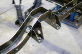 Close-up shot of Rust Buster Carrier Bearing Crossmember For 2005-2015 Toyota Tacoma RB7134 installed to the frame