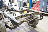 Side view of Rust Buster Spare Tire Crossmember For 1988-1995 Toyota Pickups RB7139 installed to the frame