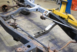 Side view of the Rust Buster Transmission Crossmember For 1988-1995 Pickups RB7142 installed to the frame