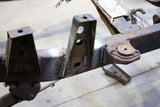 Side view of Rust Buster Middle Raised Bed Mount For 1988-1995 Toyota Hilux/Pickups RB7145 installed to the frame rail
