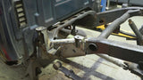 Wide angle of Rust Buster Rear Mid Frame Repair Kit For 2007-2013 GM Pickups RB7336 installed to the frame rail, as seen from the left side of the vehicle