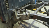 Wide angle of Rust Buster Leaf Spring Mount For 2007-2013 GM Pickups RB7337 installed to the frame rail