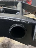 Close-up side view of Rust Buster Fuel Tank Crossmember For 2007-2013 GM Pickups RB7340 installed to the frame