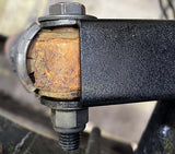 Close-up view of Rust Buster Rear Upper Shock Mount For 2007-2013 GM Pickups RB7343 installed to the frame rail