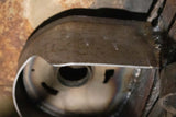 Close-up shot of Rust Buster Rear Upper Coil Spring Bucket For 2000-2014 GM SUV's RB7404 installed to the frame