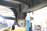 Opposing side view of Rust Buster Rear Track Bar Bracket For 2000-2014 GM SUV's RB7407 installed to the frame rail