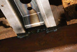 Close-up look at Rust Buster Rear Spare Tire Crossmember For 2000-2006 GM SUV's RB7414 welded to one of the frame rails