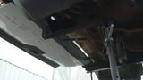 View from beneath the frame of the vehicle