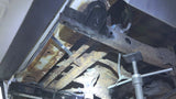 View from beneath the frame of a Chevy Avalanche, focused on Rust Buster Rear Body Frame Mount For 2000-2014 GM SUVs RB7416 