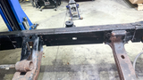 Center frame section securely installed below the cab, enhancing the frame's integrity.