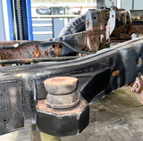 Front body mount securely welded in place, providing essential support for the vehicle's front end.