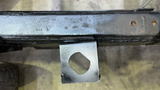 Professional installing the rear cab mount for improved structural support.