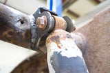 View from beneath Rust Buster Rear Shock Mount For 2001-2010 GM Pickups RB7816 installed to the frame rail