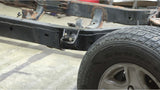 Wide angle of Rust Buster Front Body Frame Mount Bracket For 1996-2002 Toyota 4Runner RB8400 installed to the frame rail