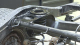 Close-up view of Rust Buster Rear Upper Coil Spring Bucket For 1996-2002 Toyota 4Runner RB8418 installed to the frame